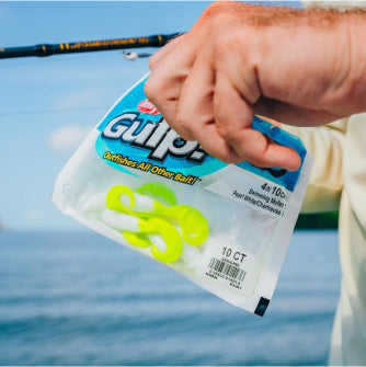 Hand holding Gulp bait packaging